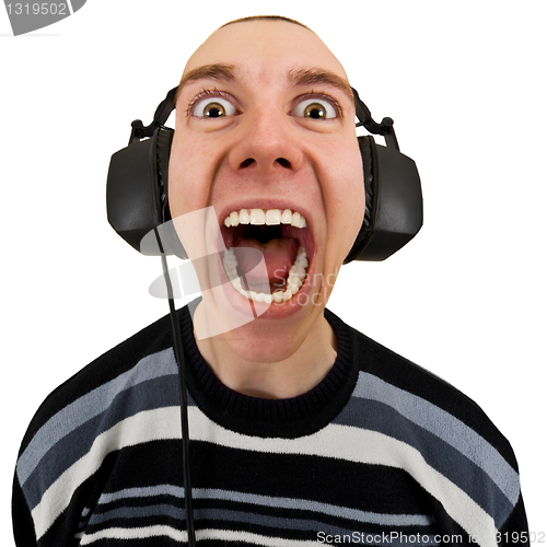 Image of Funny man in stereo headphones shouting