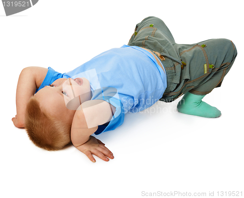 Image of Child tries to do a gymnastic stance on floor