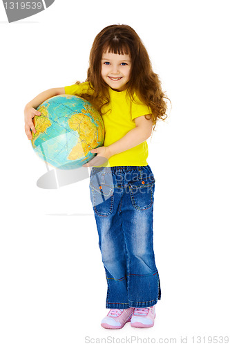 Image of Cheerful little girl in jeans with a geographic globe