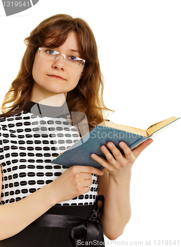 Image of Young woman in glasses with  textbook