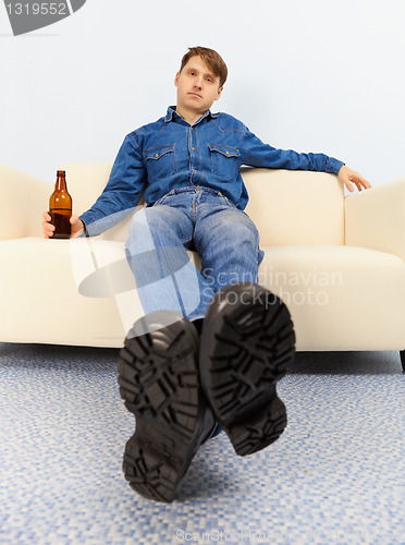 Image of Drunk dude sprawled on couch
