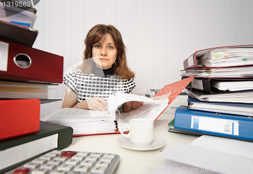 Image of Female accountant very busy in office