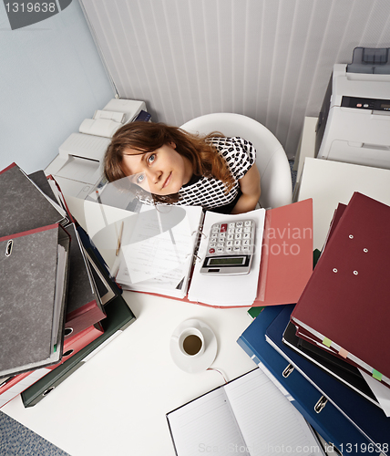 Image of Young woman - financier on office workplace