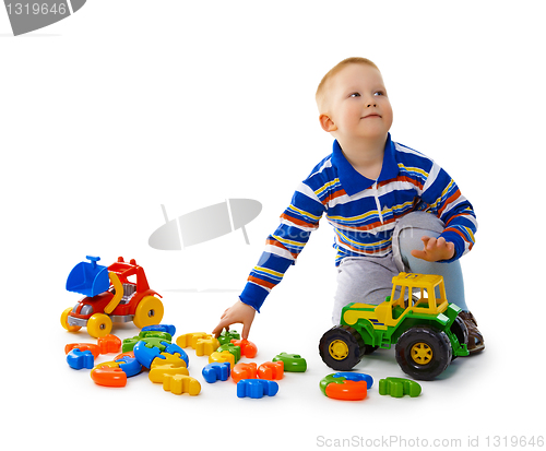 Image of Boy playing with toys