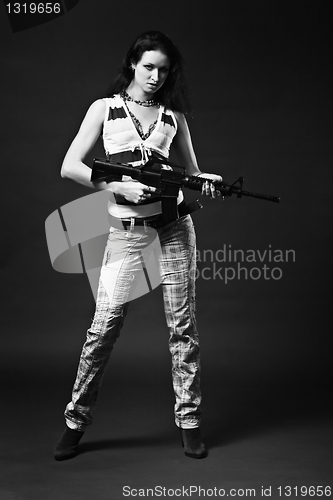Image of Girl holding a rifle - monochrome picture