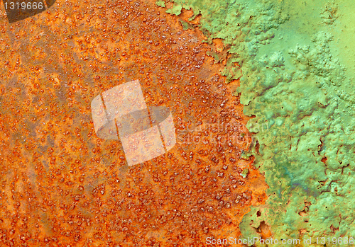 Image of Partially rotted paint on metal surface