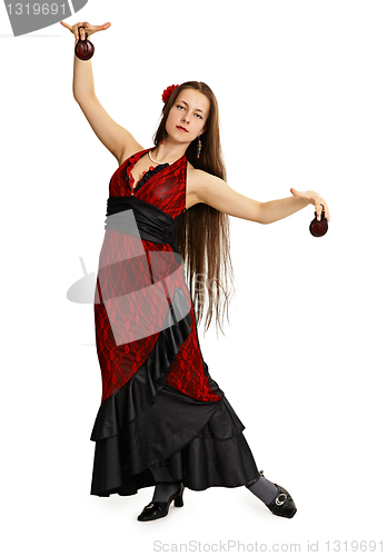 Image of Young girl in red dress performs Spanish dance