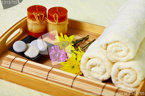 Image of Tray of towels, candles and pebbles - spa