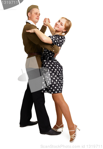 Image of Dancing couple dressed in 60s