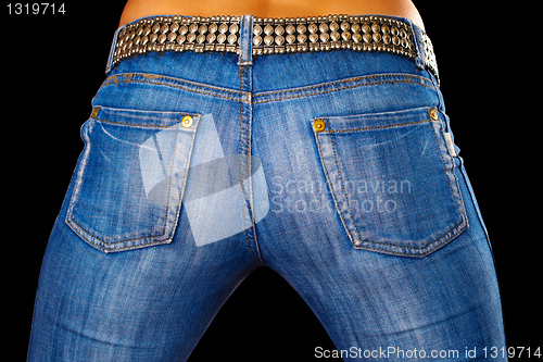 Image of Female ass dressed in jeans on black
