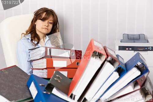 Image of Tired accountant working overtime in office