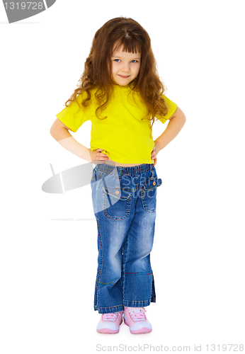 Image of Little girl in jeans on white background