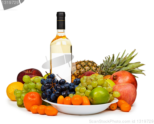 Image of Still life - bottle of white wine among fruits on white