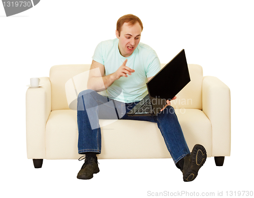 Image of Man was talking with computer on the couch