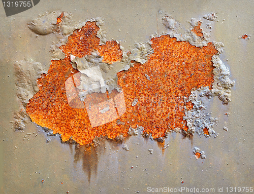 Image of Rusting on surface of iron wall