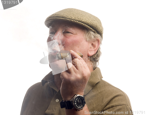 Image of handsome middle age man smoking cigar