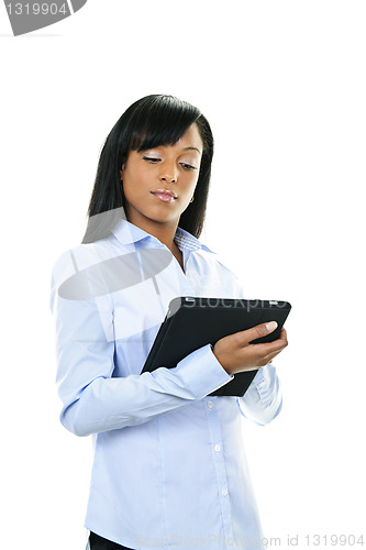 Image of Serious woman with tablet computer