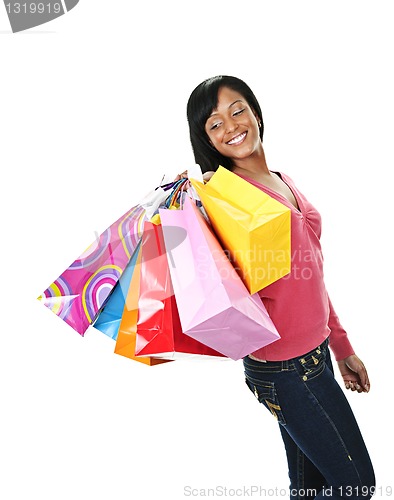 Image of Young smiling black woman with shopping bags