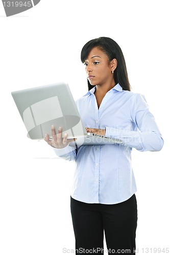 Image of Serious woman with laptop computer