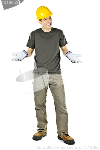 Image of Smiling construction worker shrugging