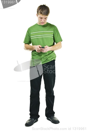 Image of Young man texting on cell phone