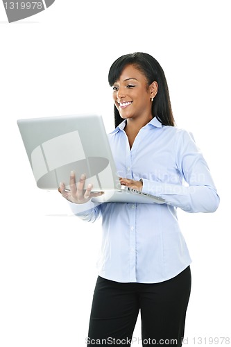 Image of Smiling woman with laptop computer