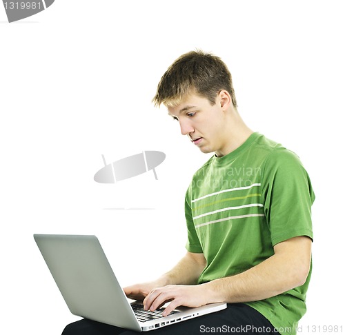 Image of Young man with laptop computer