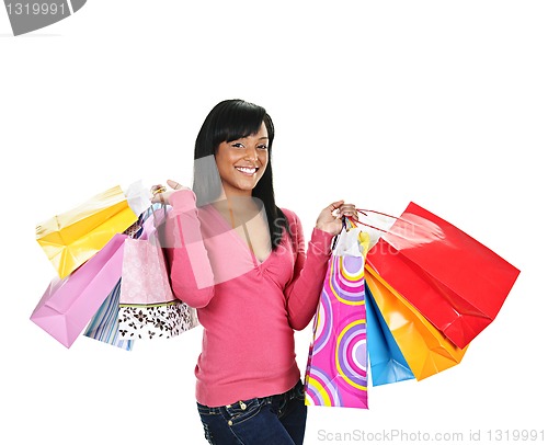 Image of Happy young black woman with shopping bags