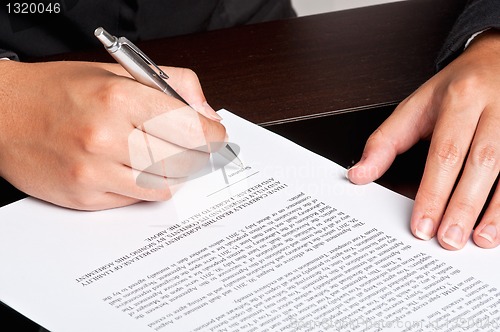 Image of Signing a Document