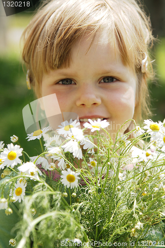 Image of Little girl with daisies