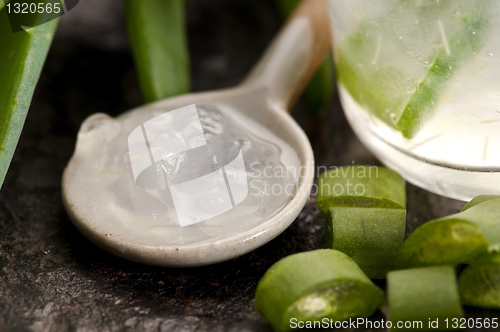 Image of aloe vera juice with fresh leaves