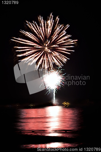 Image of Fireworks Over Water with Reflections