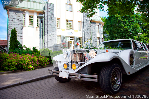 Image of White vintage wedding limousine 