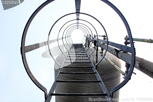 Image of Stainless steel stairway in the tanks of a modern winery 