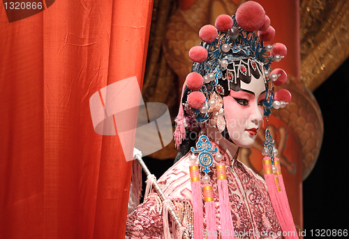 Image of chinese opera dummy and red cloth as text space ,it is a toy,not