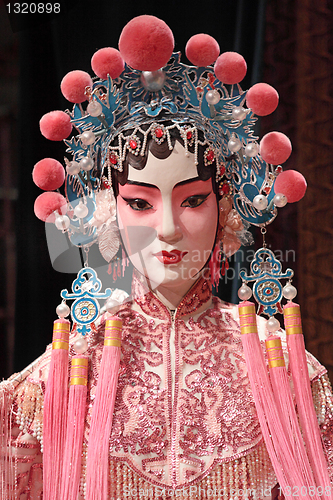 Image of chinese opera dummy and red cloth as text space ,it is a toy,not