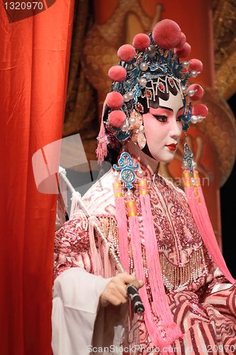 Image of chinese opera dummy and red cloth as text space ,it is a toy,not