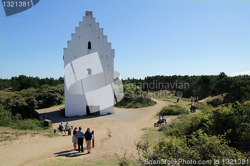 Image of White church tower.