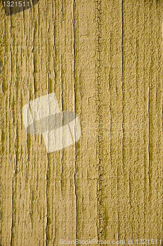 Image of Yellow paint on wood background