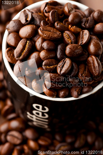 Image of Coffee mug with coffee beans