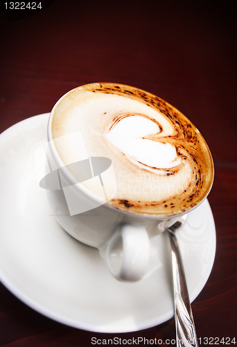 Image of Coffee cup with milk and heart shape