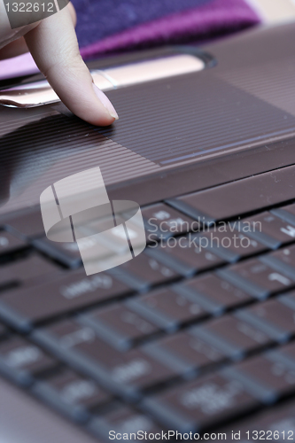 Image of Working at laptop .