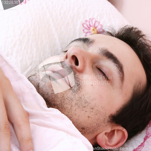Image of Young man sleeping .