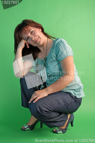 Image of fashion woman on green background. studio shot.