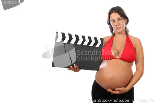 Image of pregnant woman with beautiful belly holding movie clacket