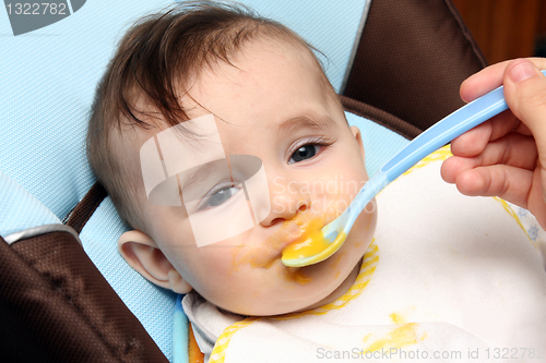 Image of beautiful child eating soup, food child photo