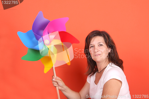 Image of beautiful girl with wind mill, studio session shoot