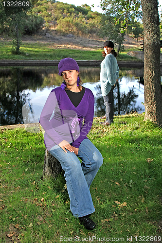 Image of  beautiful woman in an autumn park 