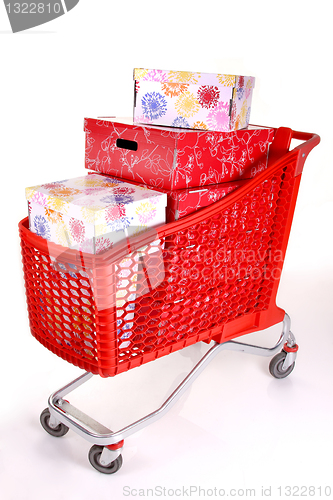 Image of Shopping cart with lots of presents isolated on white background