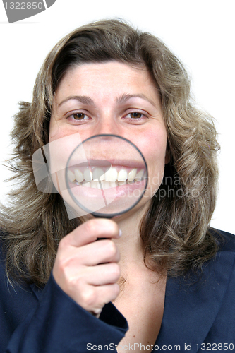 Image of Young businesswoman holding Magnifying Glass, business photo